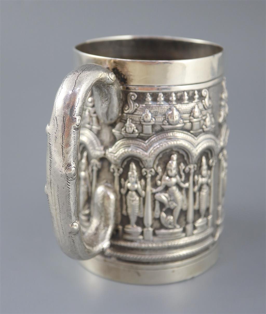 A late 19th century Indian repousse silver mug by P. Orr & Sons, Madras,